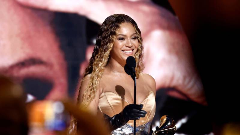 Beyonce receives a Grammy Award on stage.